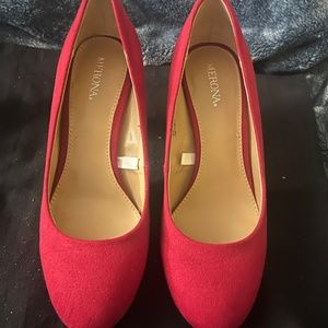 Red suede pumps